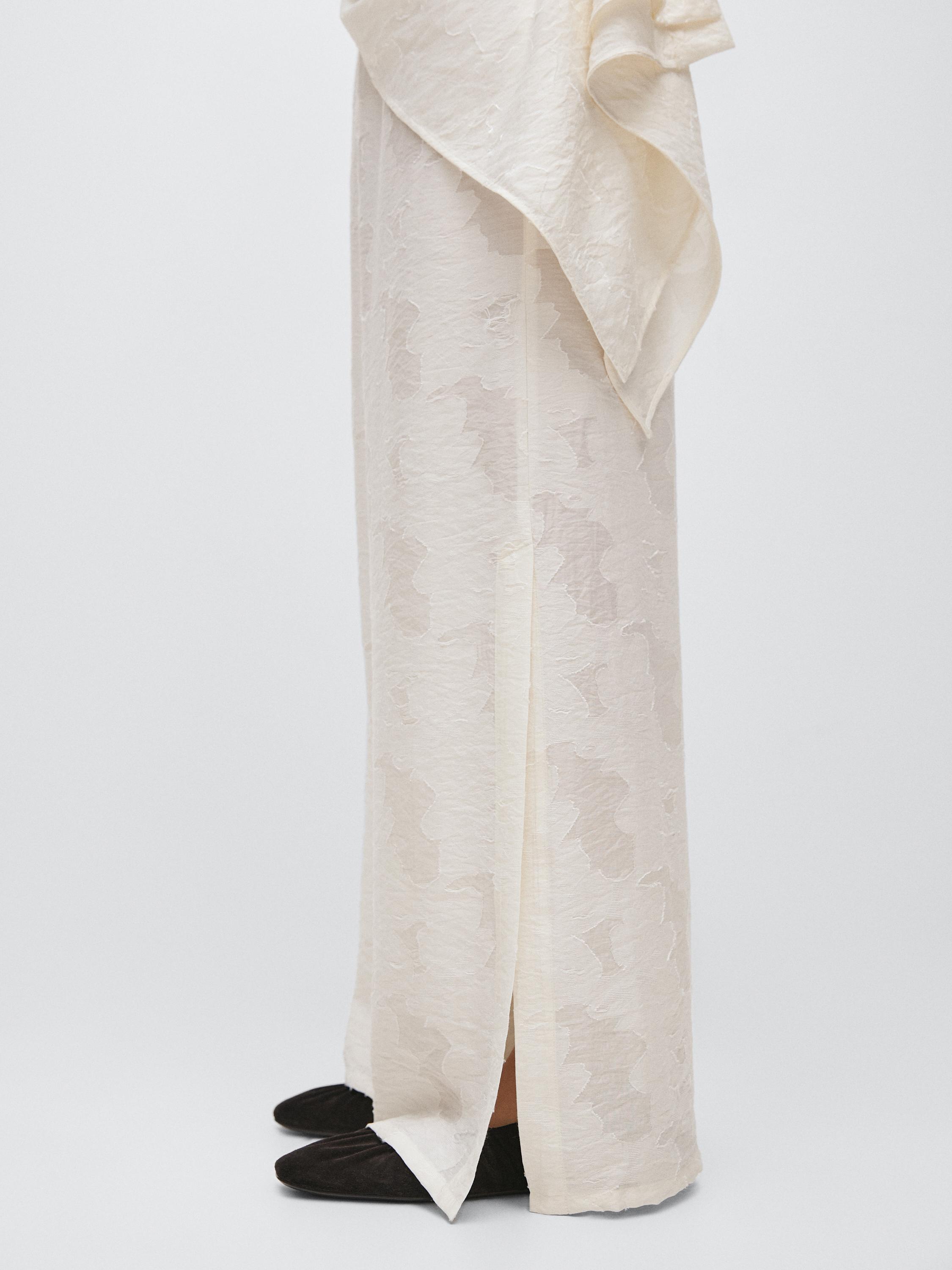 Flowing stretch trousers with fabric detail